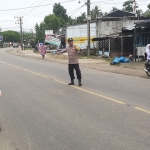 Polsek Rantau Selamat Laksanakan Strong Point Pagi di Jalan Medan–Banda Aceh