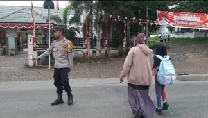 Polsek Rantau Selamat Laksanakan Strong Point Pagi di Jalan Medan–Banda Aceh