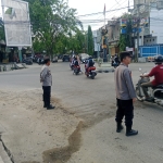 Polsek Langsa Laksanakan Protap 01 Pengaturan Lalin di Titik Rawan Kemacetan