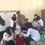 Polsek Manyak Payed Dukung Program Imunisasi Anak di SDN Sapta Marga